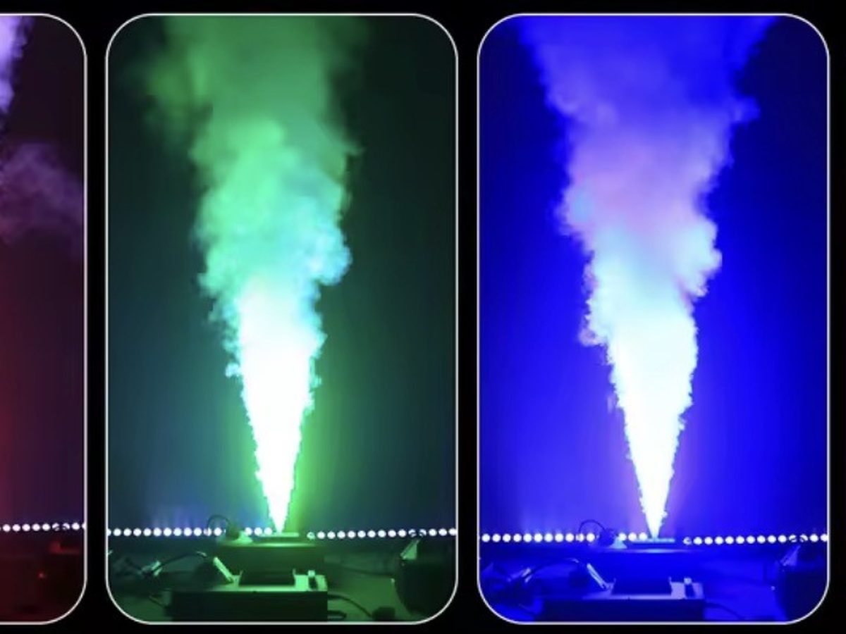 Vertical columns of smoke lit in green and blue, shooting up from the floor of a dance floor.